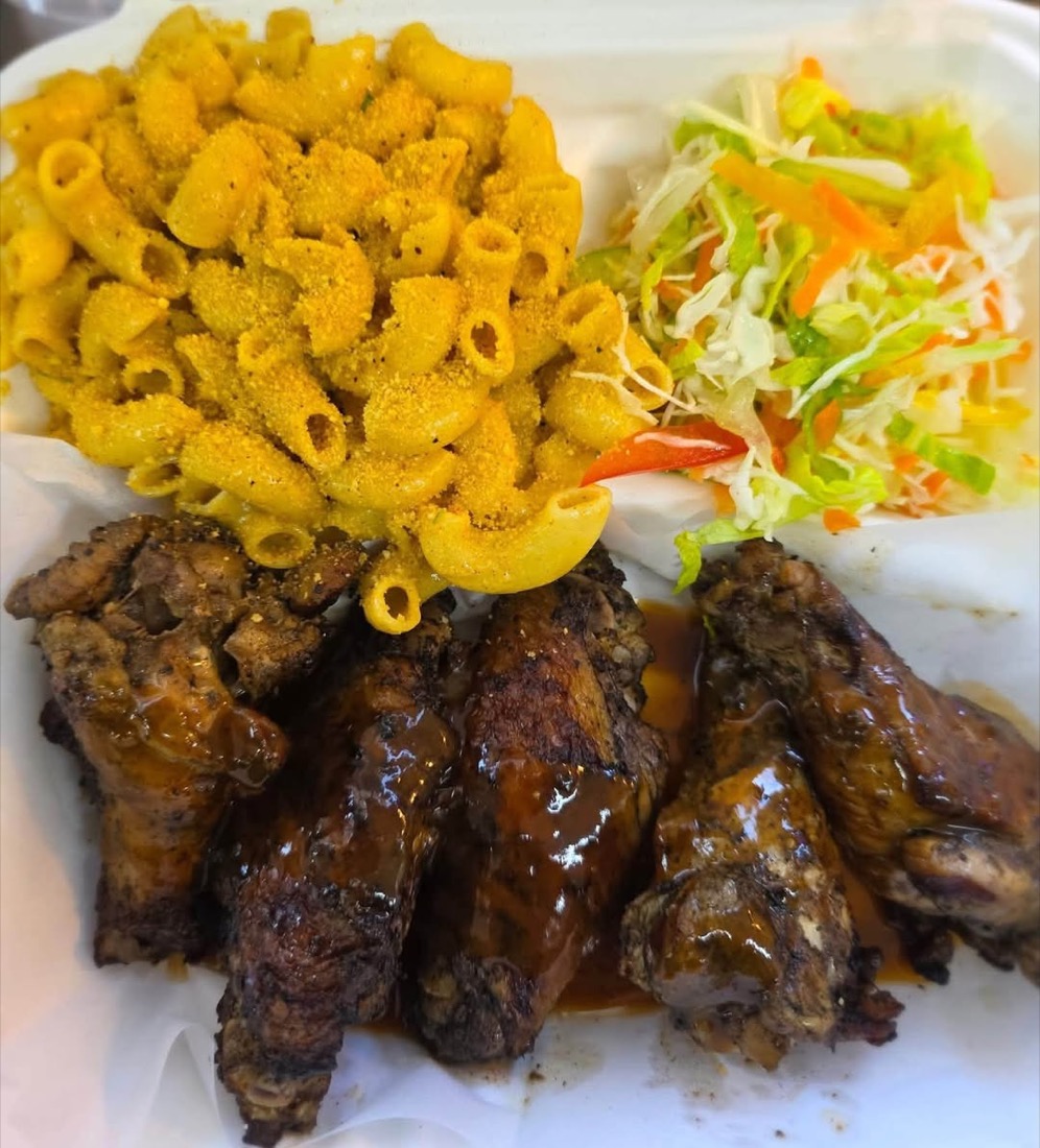 Jerk chicken plate with macaroni and cabbage slaw